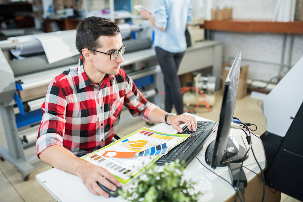 a designer working in a printing company