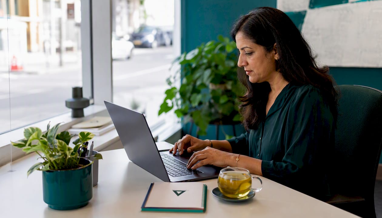 Woman researching local keywords at desk
