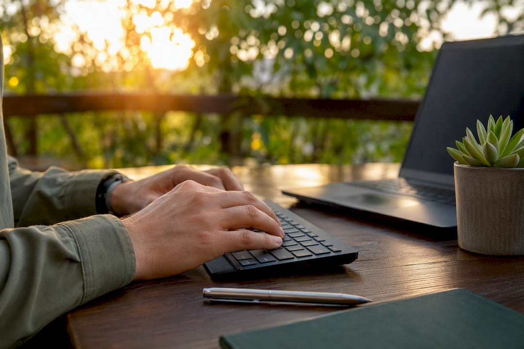 Hands typing short notes at professional desk