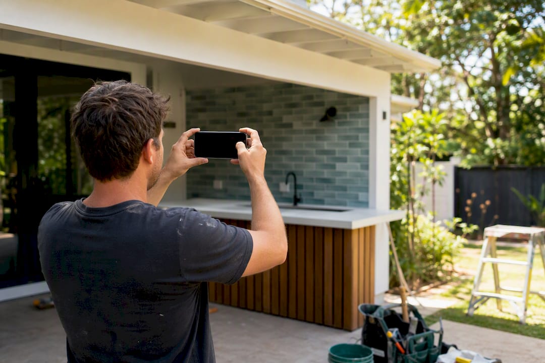 Tradie photographing completed job